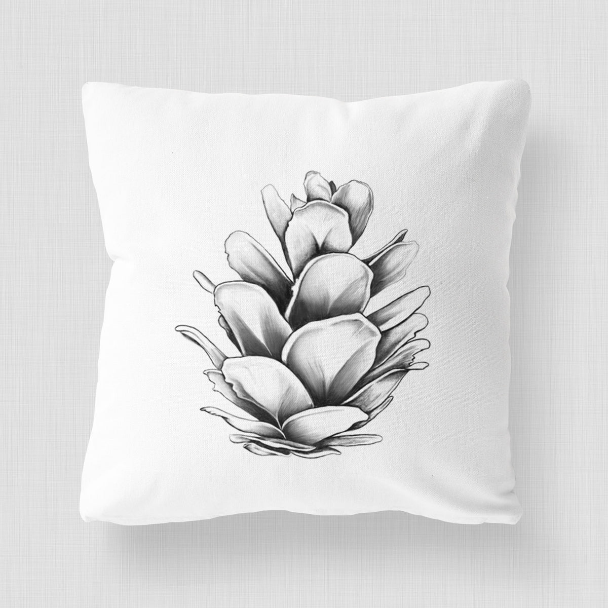 White pillow cover printed with a detailed black ink illustration of a western hemlock pine cone.