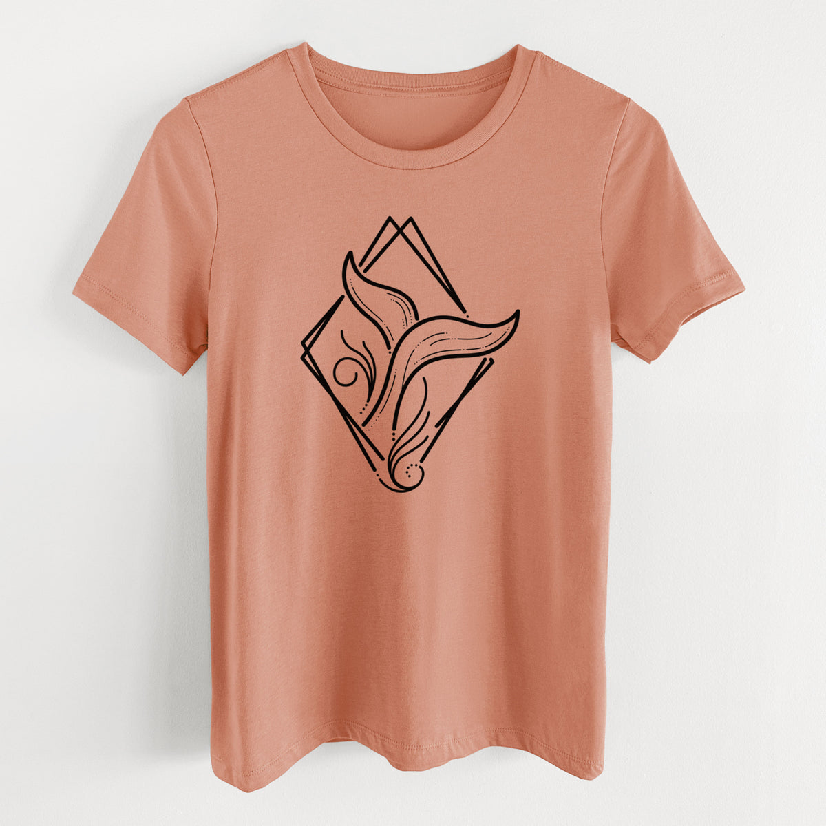Terracotta orange women's relaxed fit cotton t-shirt laid flat, printed with a black line art whale tail rising from a wave inside a diamond outline.