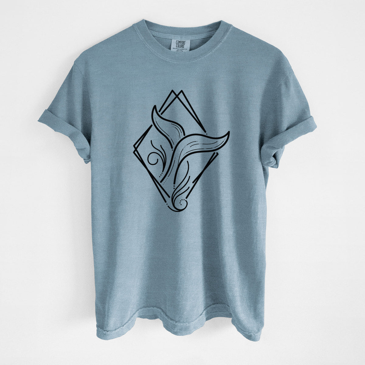 Steel blue Comfort Colors t-shirt laid flat, printed with a black line art whale tail rising from a wave inside a diamond outline.
