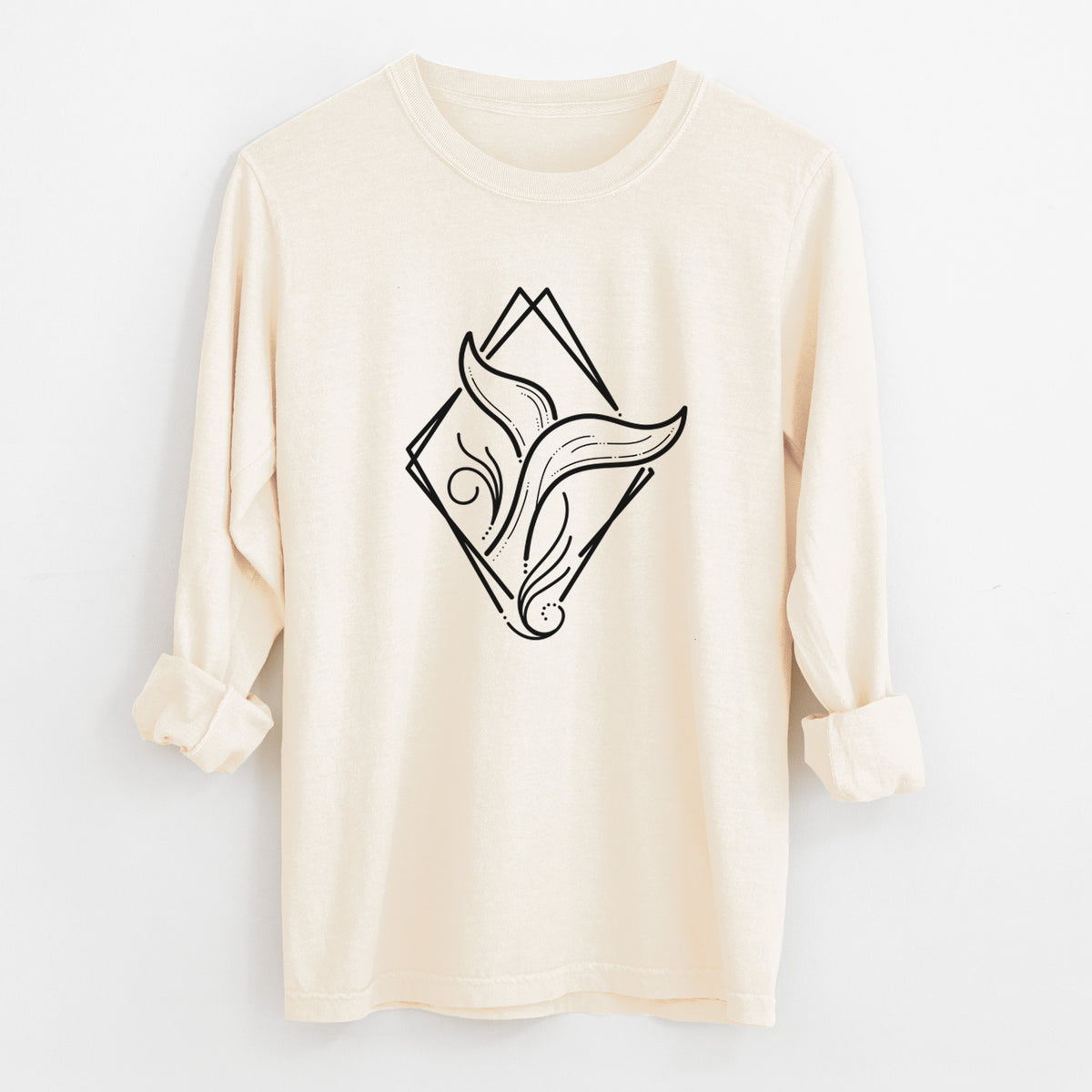Ivory Comfort Colors long sleeve shirt laid flat with the cuffs rolled, printed with a black line art whale tail rising from a wave inside a diamond outline.