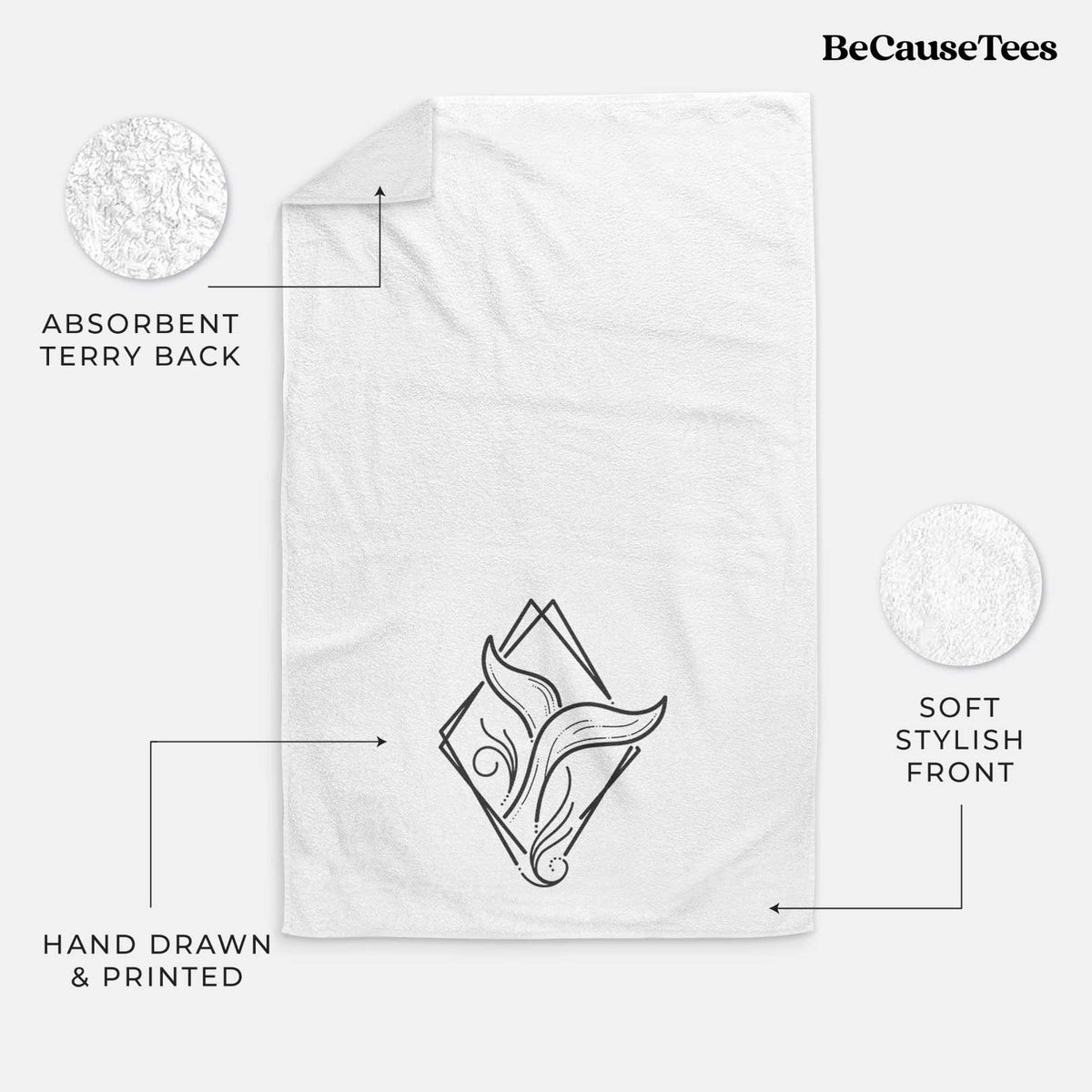 White hand towel printed with a black line art whale tail rising from a wave inside a diamond outline.