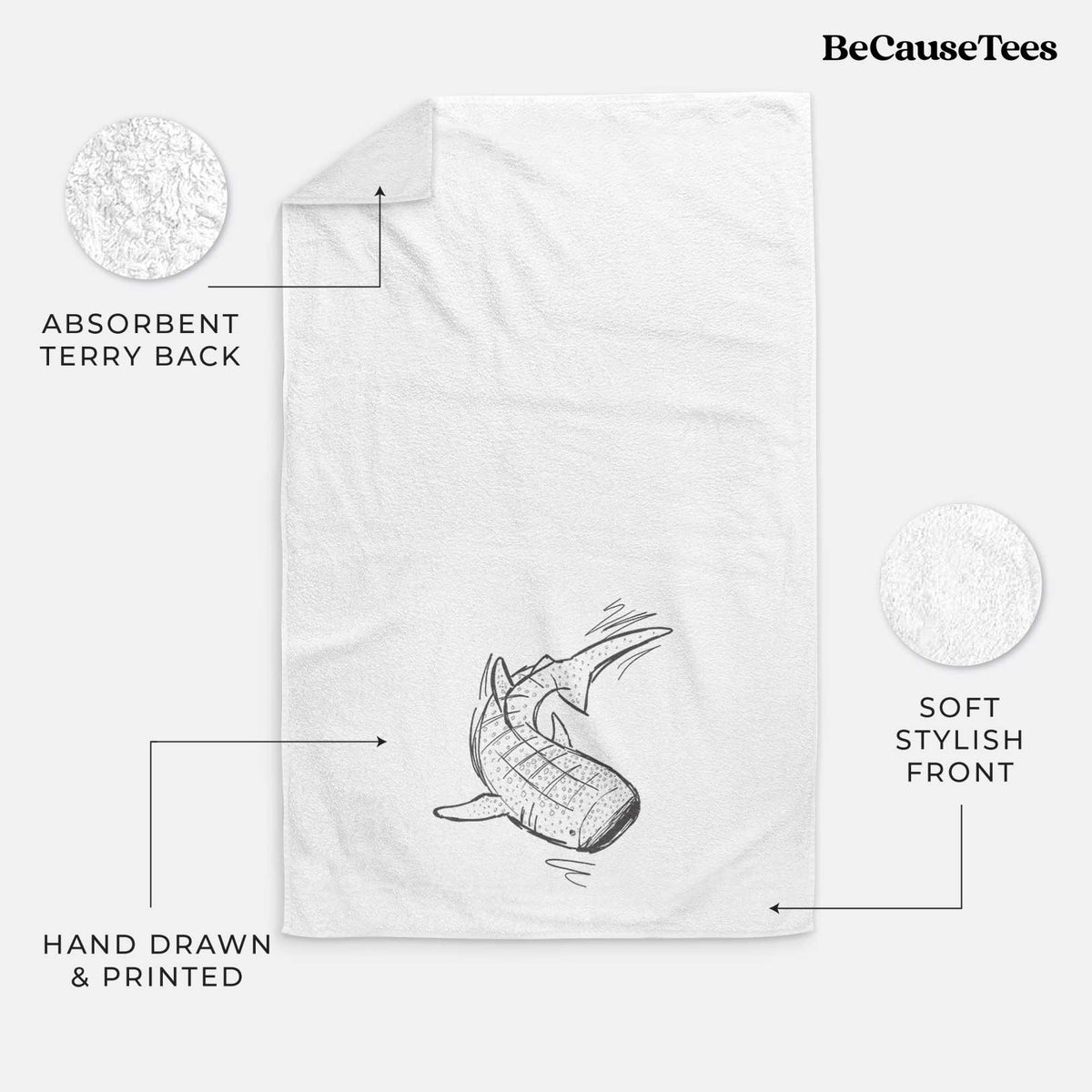 White hand towel printed with a black ink illustration of a spotted whale shark swimming.