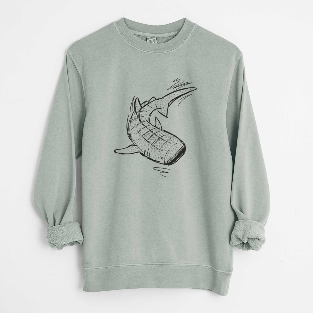 Sage green pigment dyed crewneck sweatshirt laid flat with the sleeves rolled, printed with a black ink illustration of a spotted whale shark swimming.