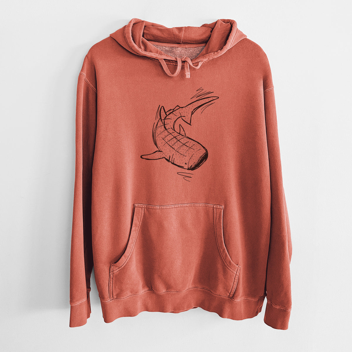 Amber orange pigment dyed hoodie laid flat, printed with a black ink illustration of a spotted whale shark swimming.