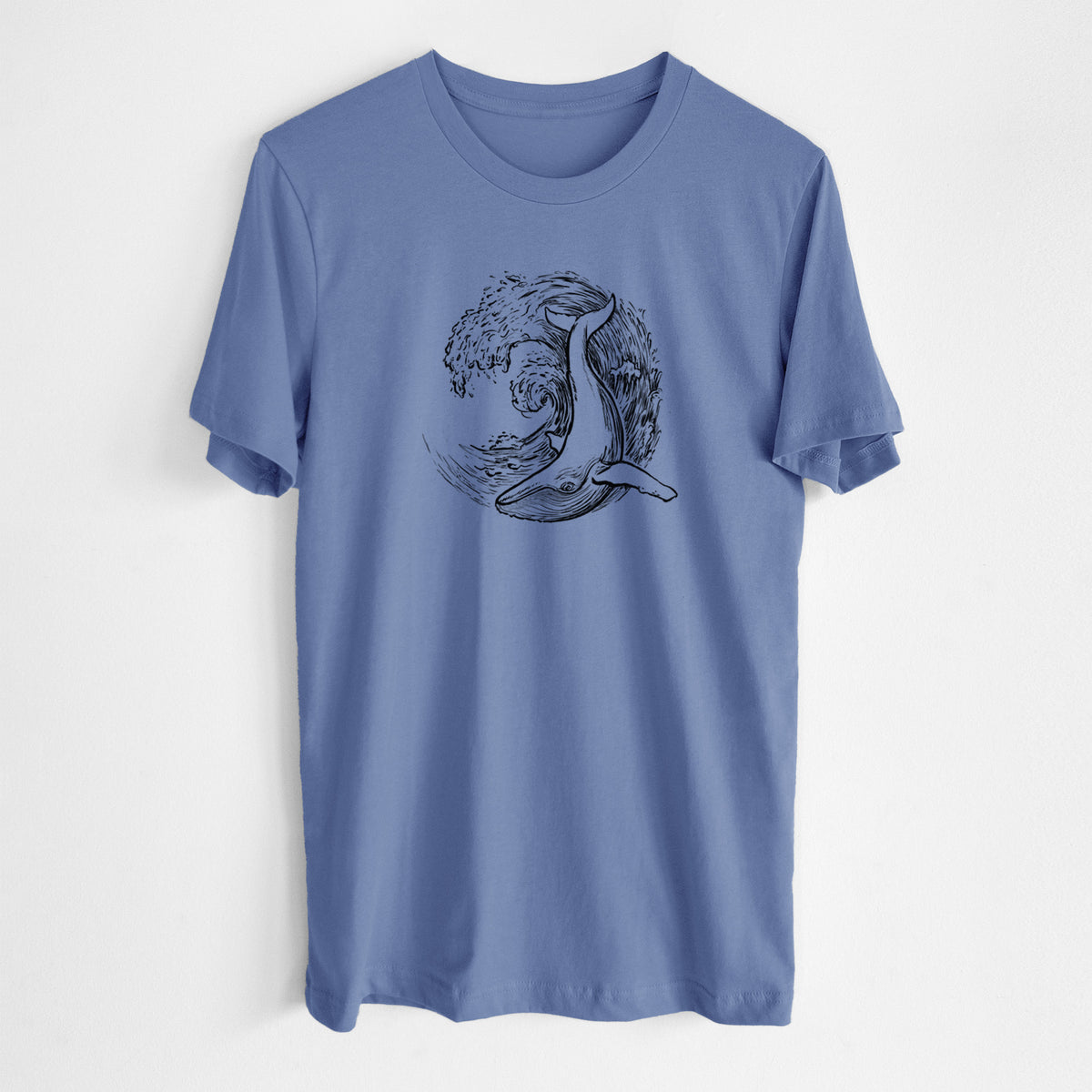 Blue bell lightweight cotton t-shirt laid flat, printed with a black ink illustration of a humpback whale swimming inside a curling ocean wave.