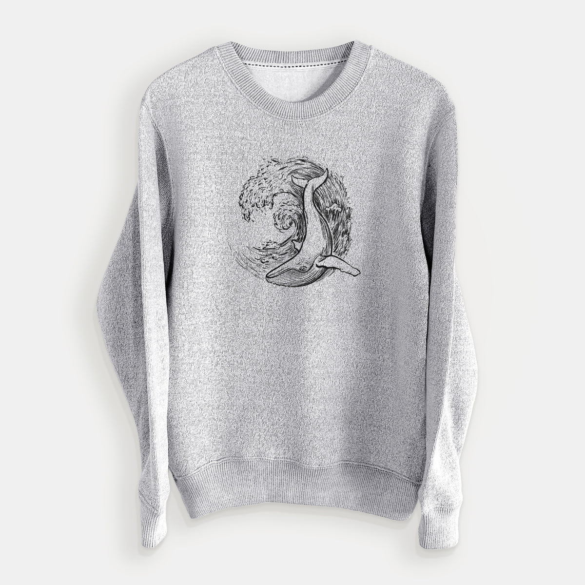 Salt and pepper knit sweatshirt laid flat, printed with a black ink illustration of a humpback whale swimming inside a curling ocean wave.