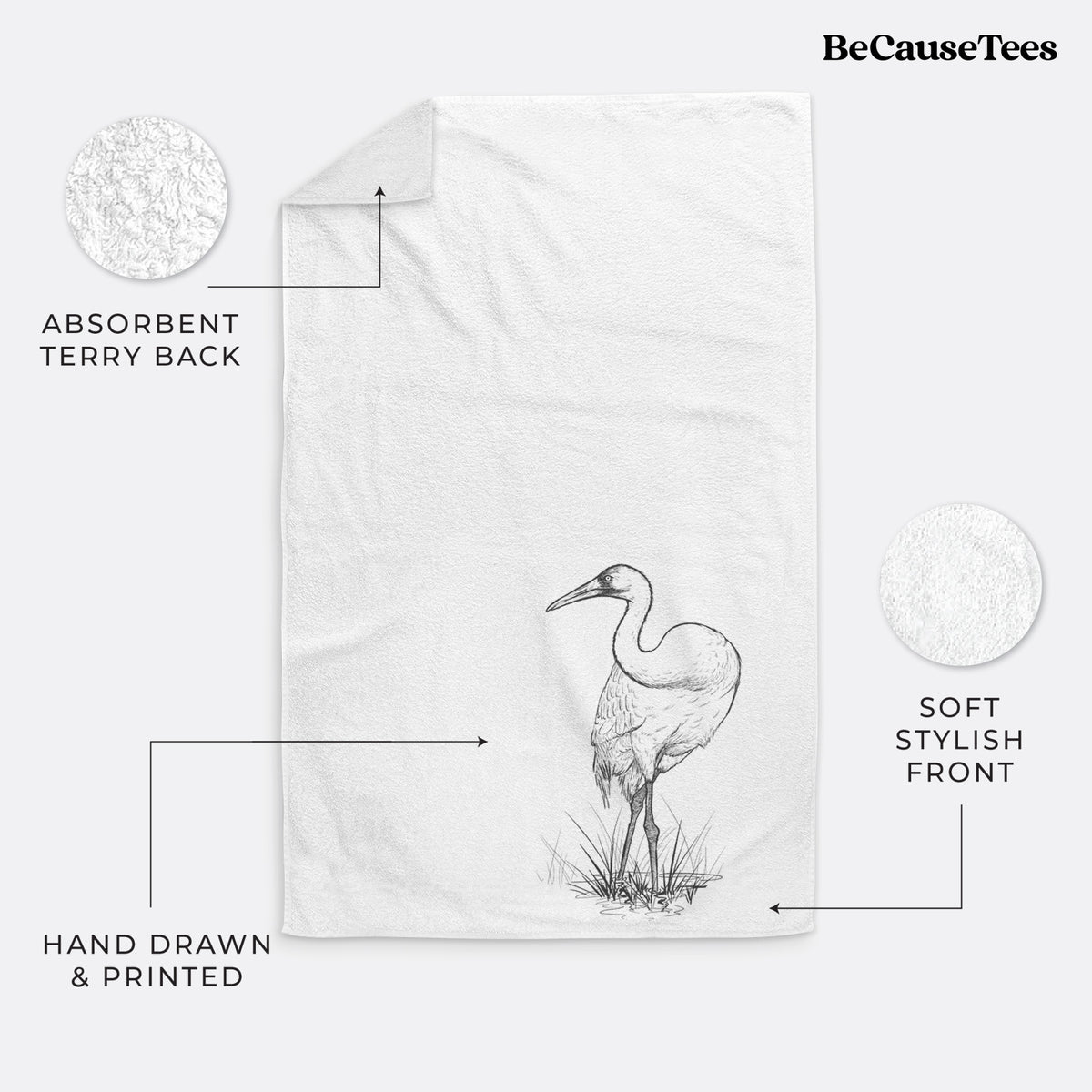 White hand towel printed with a detailed black ink illustration of a whooping crane standing in grass.