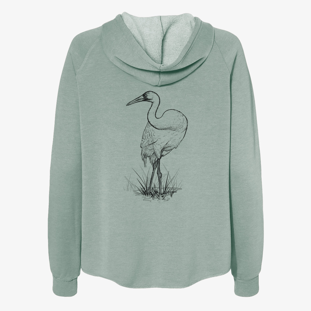 Sage green women's Cali Wave zip-up sweatshirt laid flat, printed with a detailed black ink illustration of a whooping crane standing in grass.