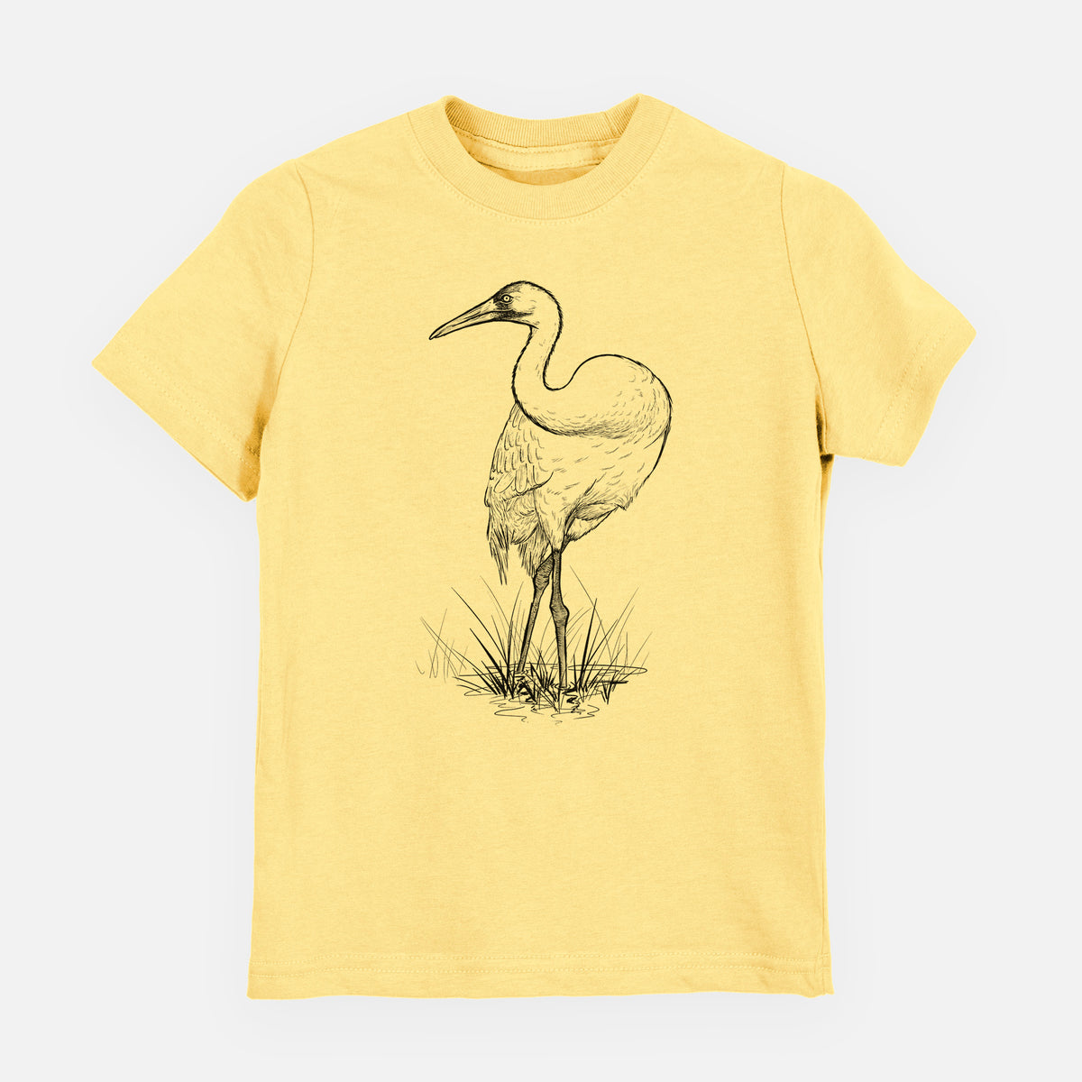 Butter yellow youth t-shirt laid flat, printed with a detailed black ink illustration of a whooping crane standing in grass.