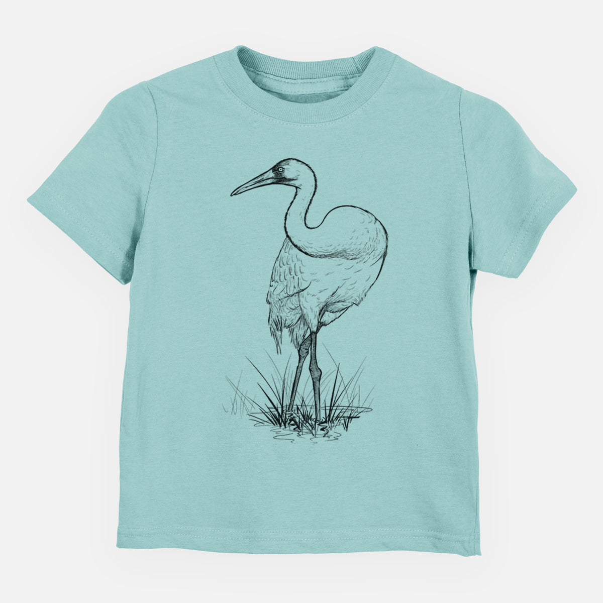 Saltwater toddler t-shirt laid flat, printed with a detailed black ink illustration of a whooping crane standing in grass.