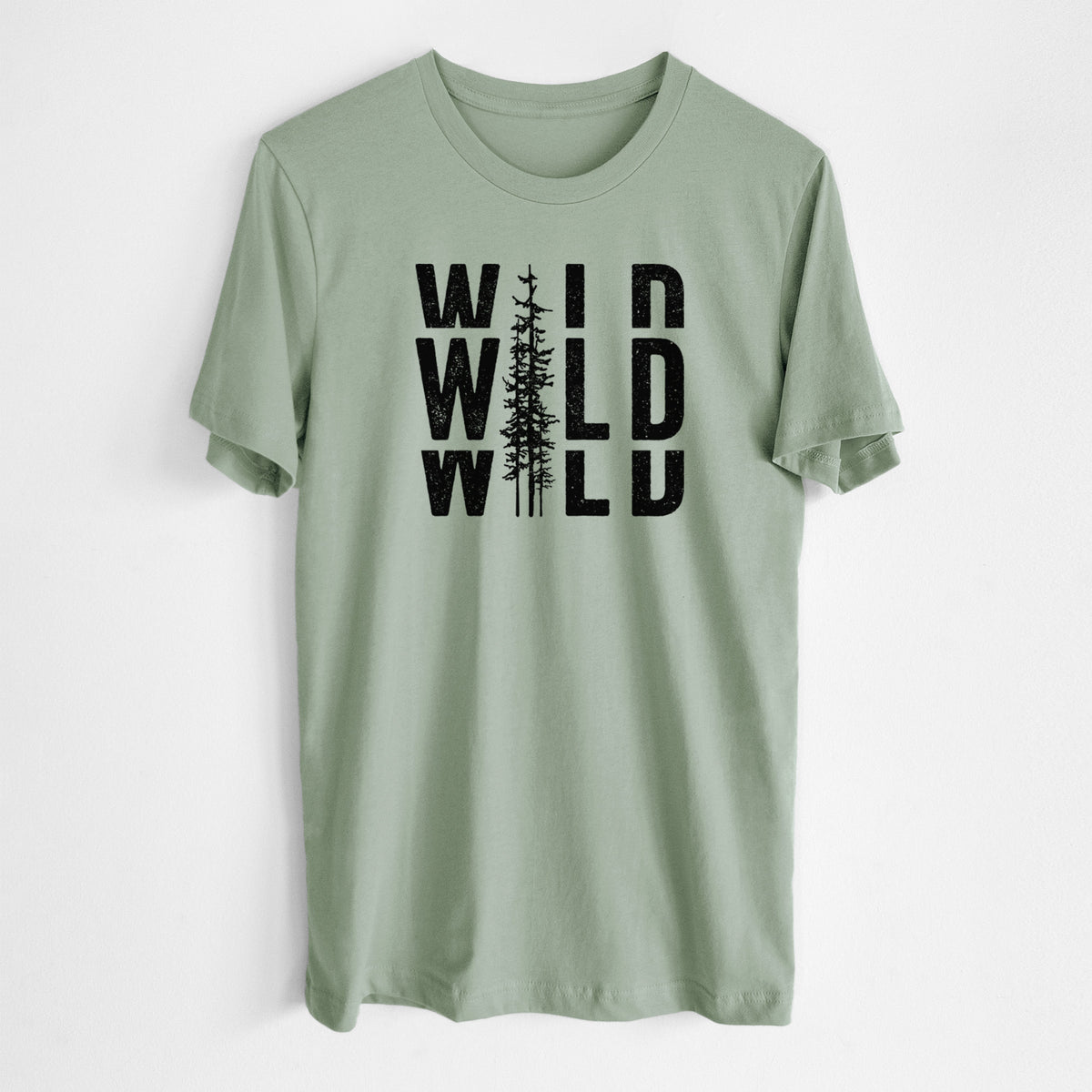 Sage green lightweight cotton t-shirt laid flat, printed with bold black text reading WILD stacked three times, with a tall pine tree forming the letter I.