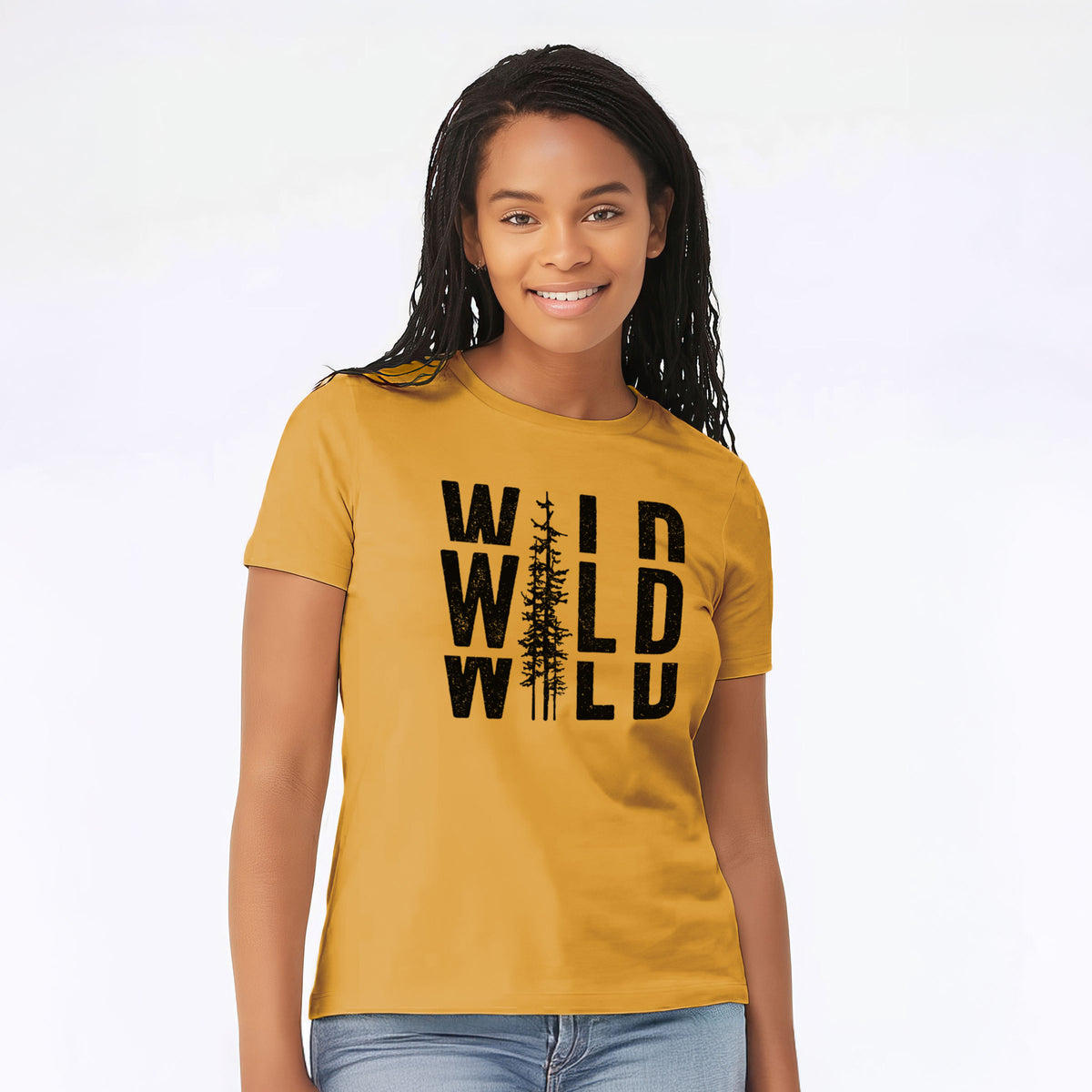 Woman wearing a mustard yellow women's relaxed fit cotton t-shirt printed with bold black text reading WILD stacked three times, with a tall pine tree forming the letter I.