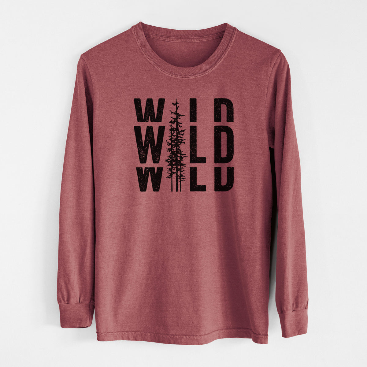 Brick red Comfort Colors long sleeve shirt laid flat, printed with bold black text reading WILD stacked three times, with a tall pine tree forming the letter I.