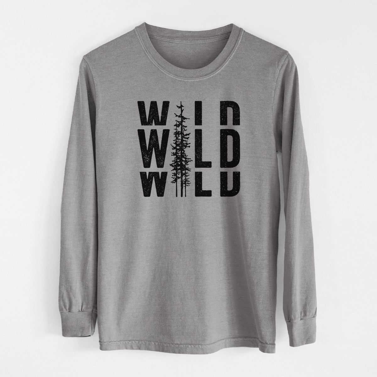 Grey Comfort Colors long sleeve shirt laid flat, printed with bold black text reading WILD stacked three times, with a tall pine tree forming the letter I.