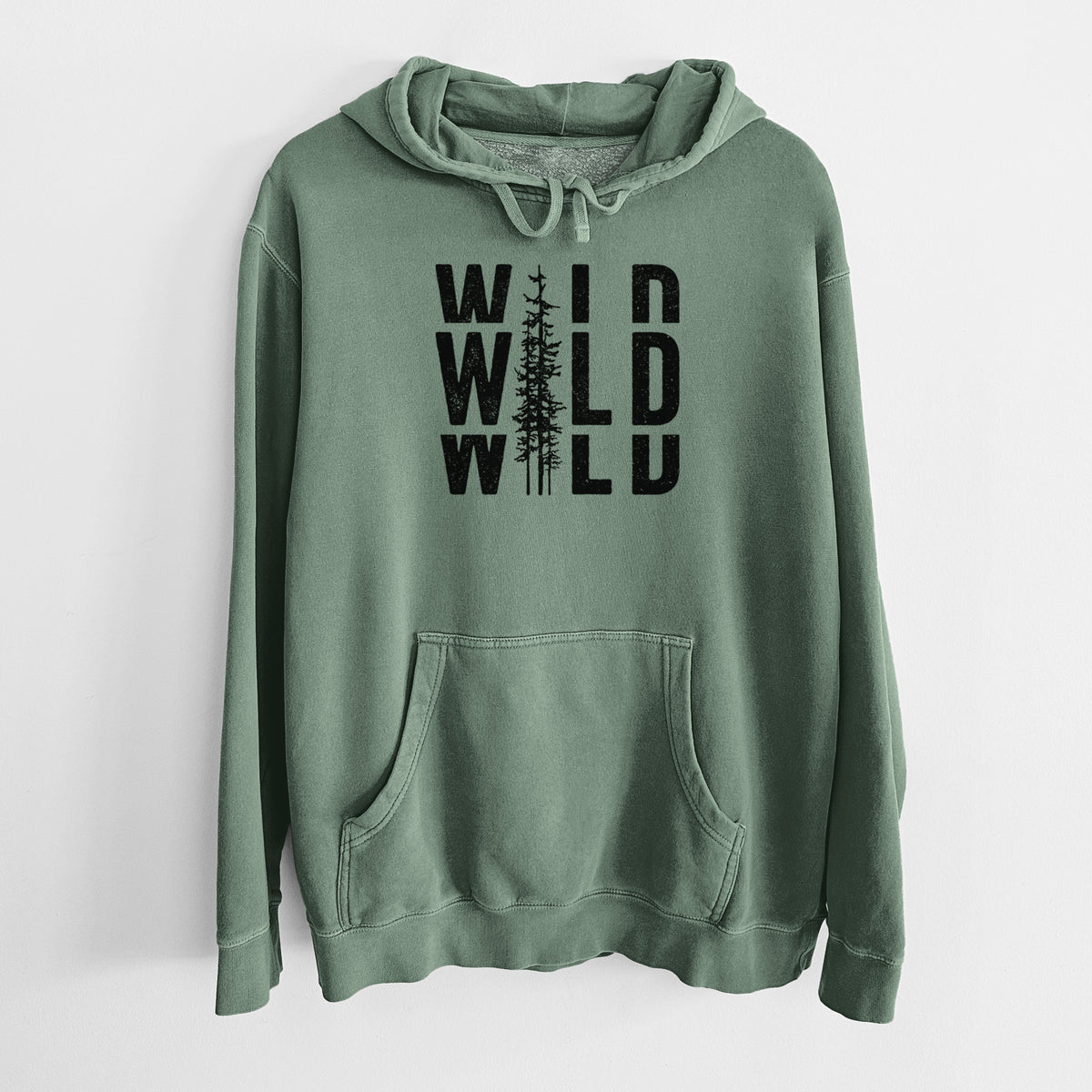 Alpine green pigment dyed hoodie laid flat, printed with bold black text reading WILD stacked three times, with a tall pine tree forming the letter I.