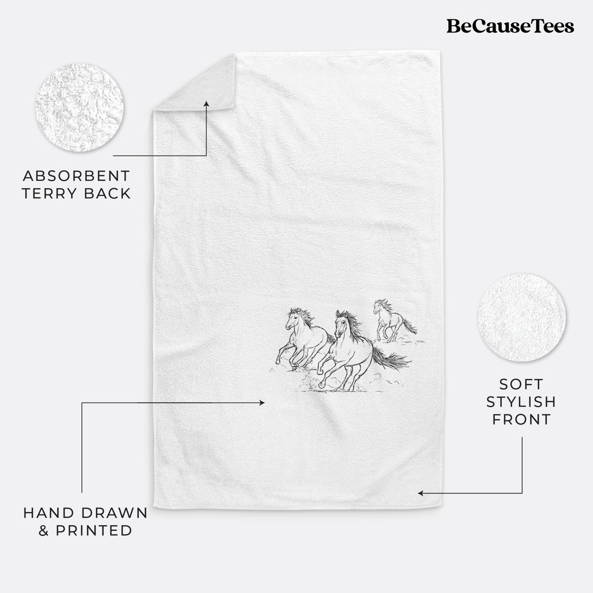 White hand towel printed with a black ink illustration of three wild horses galloping.
