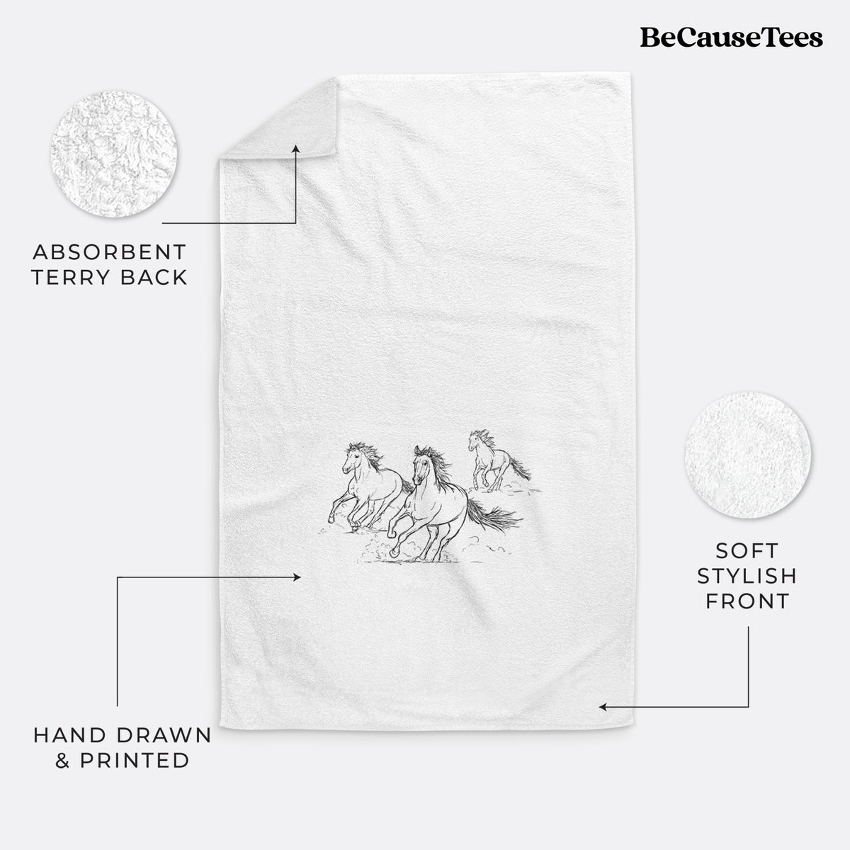 White hand towel printed with a black ink illustration of three wild horses galloping.