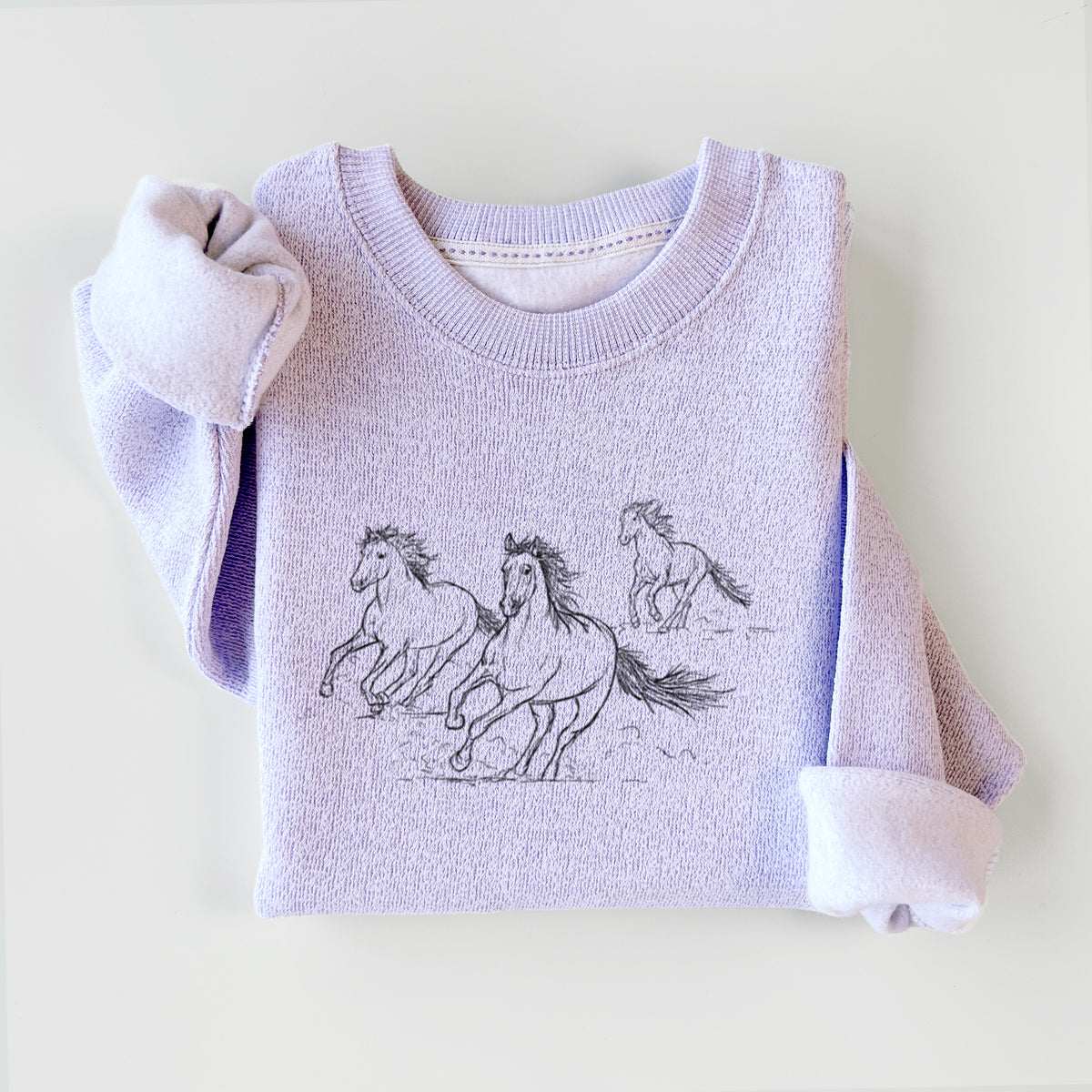 Ice purple knit sweatshirt printed with a black ink illustration of three wild horses galloping, styled flat.