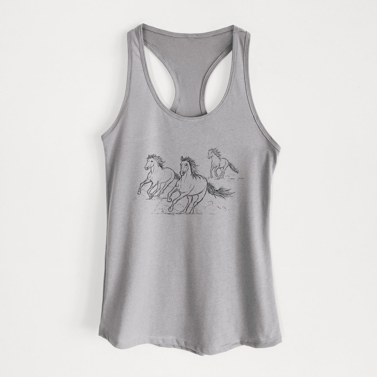 Heather grey women's racerback tank top laid flat, printed with a black ink illustration of three wild horses galloping.