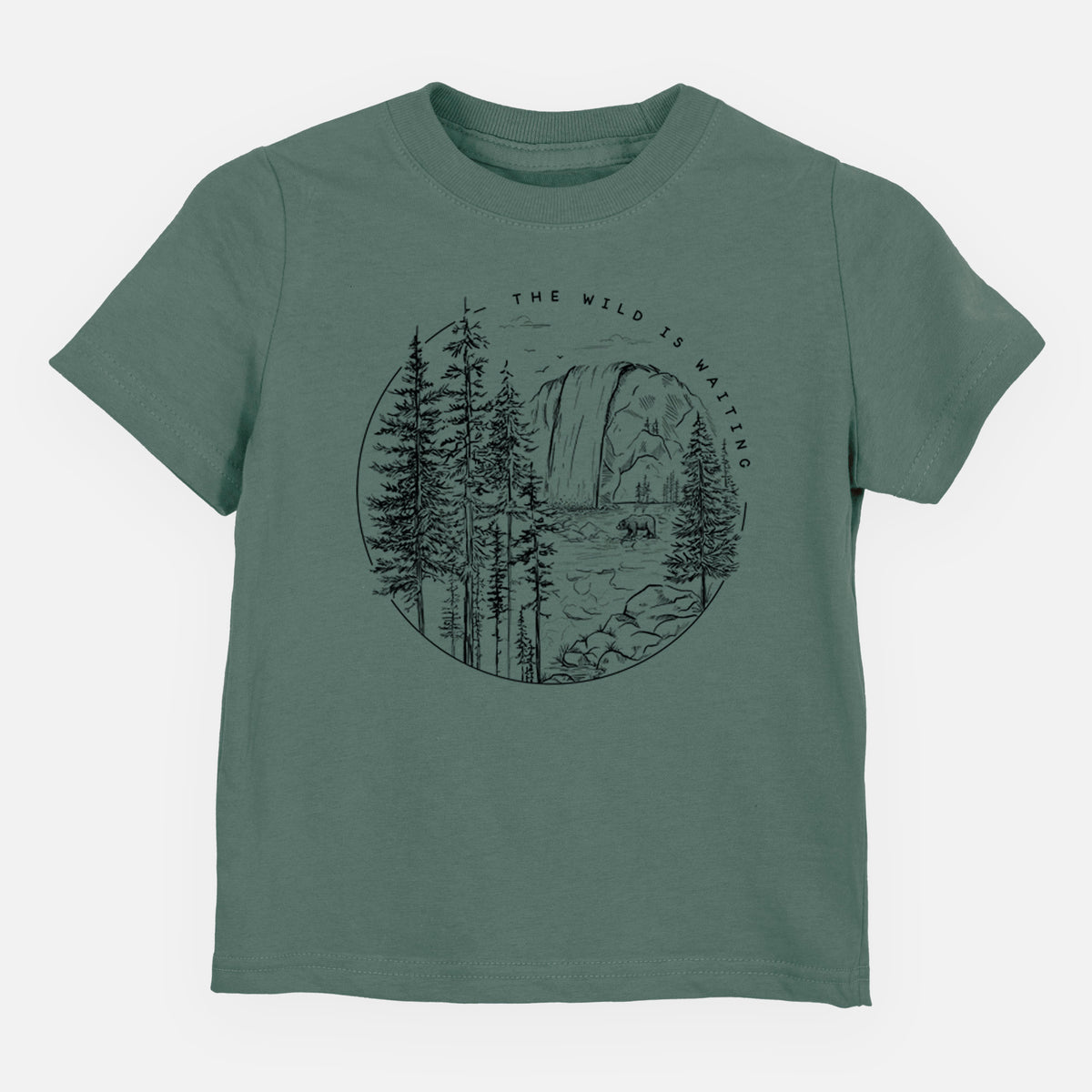 Basil green toddler t-shirt laid flat, printed with a round black ink scene of a waterfall, pine trees and a river, with the words The Wild Is Waiting.