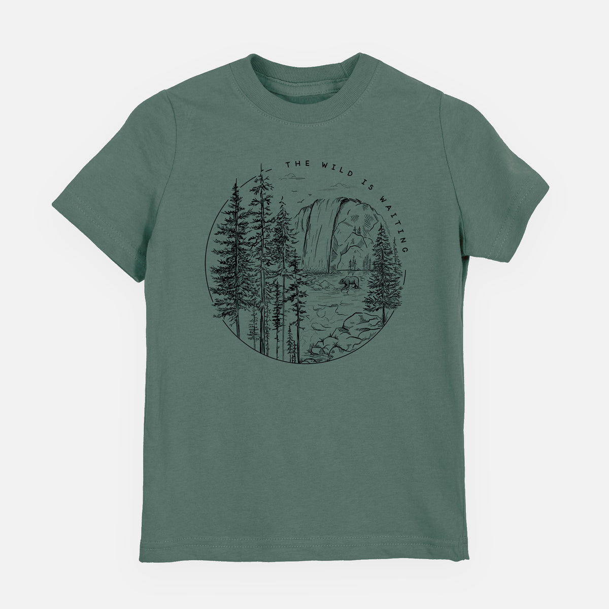 Basil green youth t-shirt laid flat, printed with a round black ink scene of a waterfall, pine trees and a river, with the words The Wild Is Waiting.