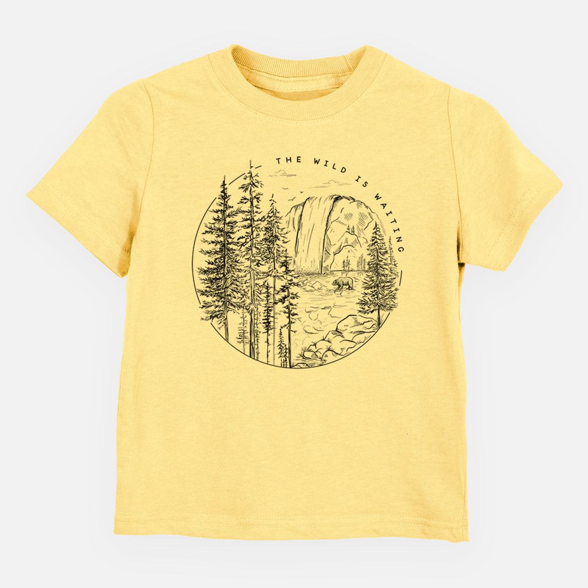 Butter yellow toddler t-shirt laid flat, printed with a round black ink scene of a waterfall, pine trees and a river, with the words The Wild Is Waiting.