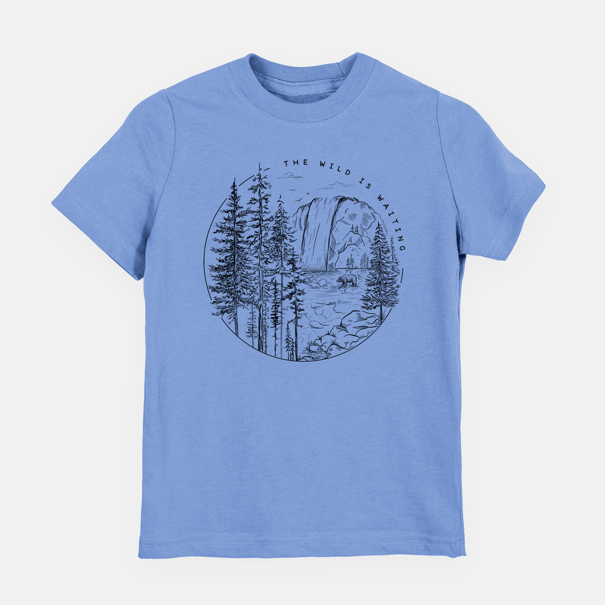 Carolina blue youth t-shirt laid flat, printed with a round black ink scene of a waterfall, pine trees and a river, with the words The Wild Is Waiting.