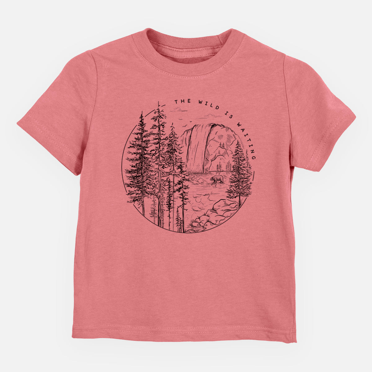 Mauve pink toddler t-shirt laid flat, printed with a round black ink scene of a waterfall, pine trees and a river, with the words The Wild Is Waiting.