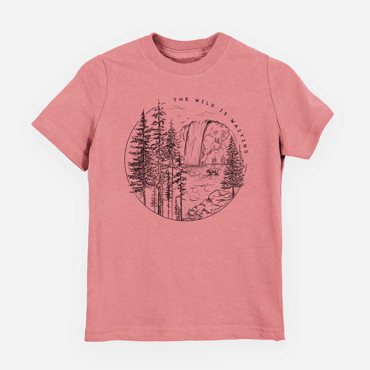 Mauve pink youth t-shirt laid flat, printed with a round black ink scene of a waterfall, pine trees and a river, with the words The Wild Is Waiting.