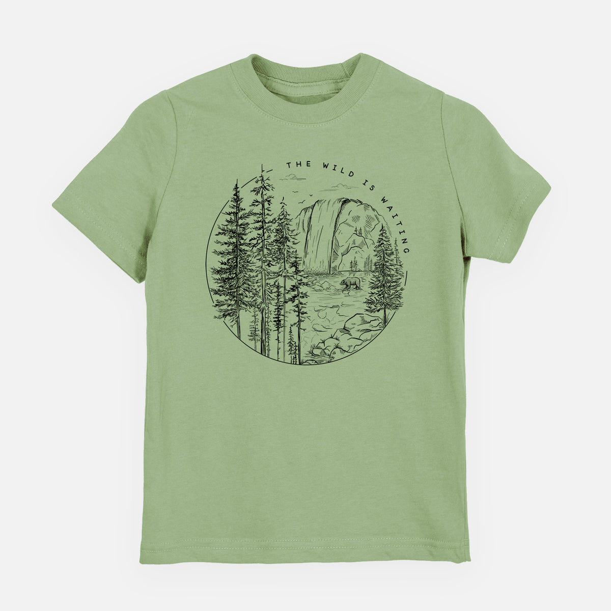 Sage green youth t-shirt laid flat, printed with a round black ink scene of a waterfall, pine trees and a river, with the words The Wild Is Waiting.