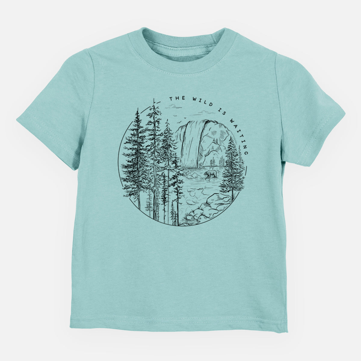 Saltwater toddler t-shirt laid flat, printed with a round black ink scene of a waterfall, pine trees and a river, with the words The Wild Is Waiting.