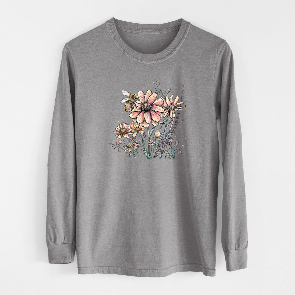 Grey Comfort Colors long sleeve shirt laid flat, printed with a soft full-color illustration of a bee flying over pink and purple wildflowers.