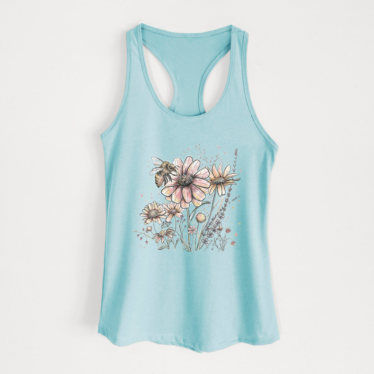 Cancun blue women's racerback tank top laid flat, printed with a soft full-color illustration of a bee flying over pink and purple wildflowers.