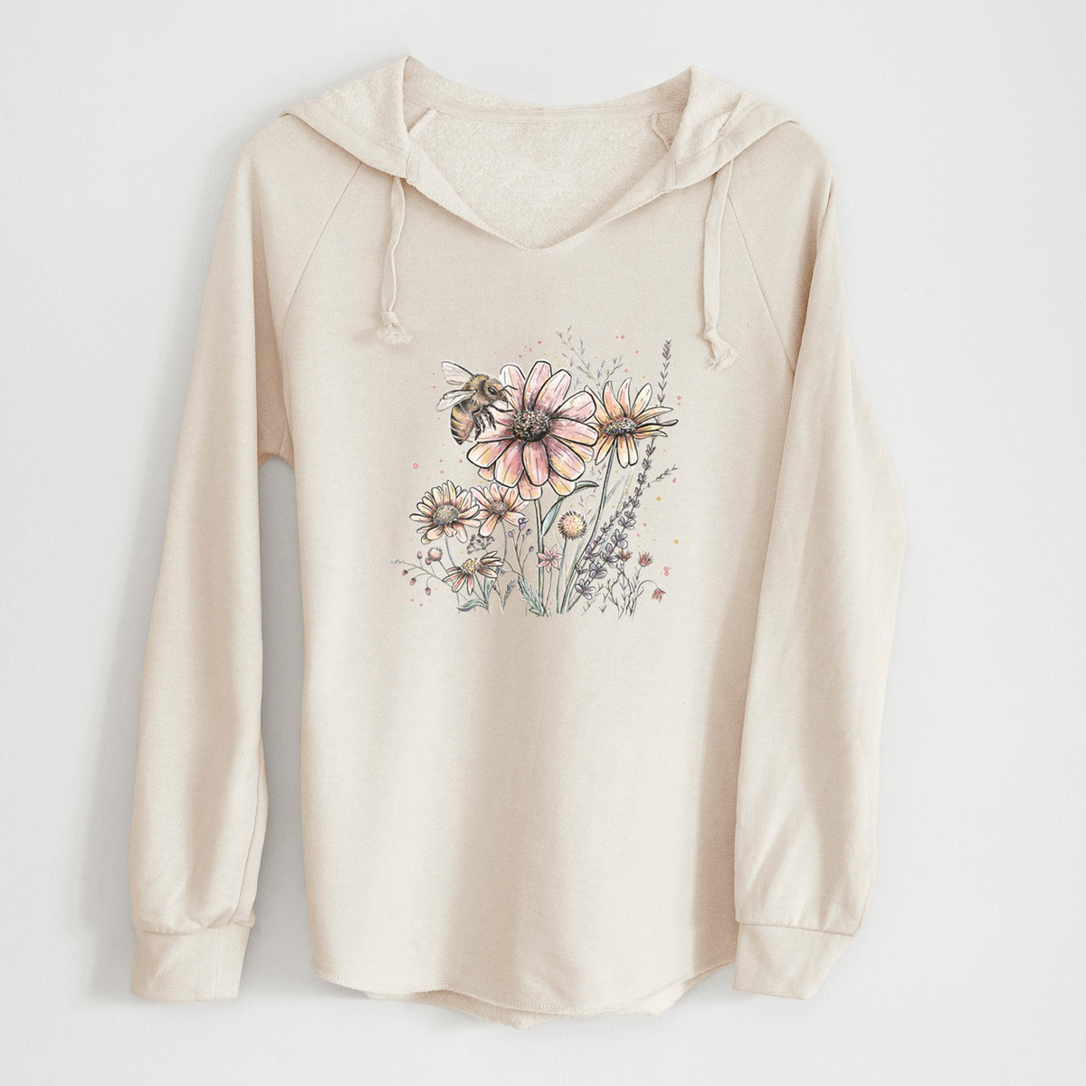 Bone cream women's Cali Wave hooded sweatshirt laid flat, printed with a soft full-color illustration of a bee flying over pink and purple wildflowers.