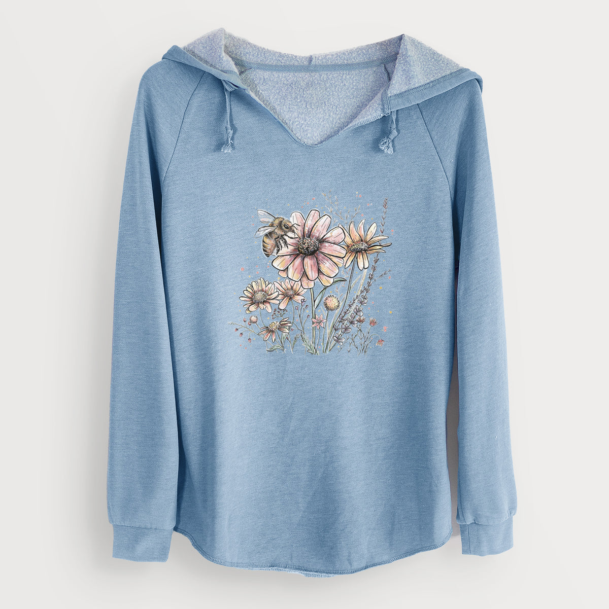 Misty blue women's Cali Wave hooded sweatshirt laid flat, printed with a soft full-color illustration of a bee flying over pink and purple wildflowers.