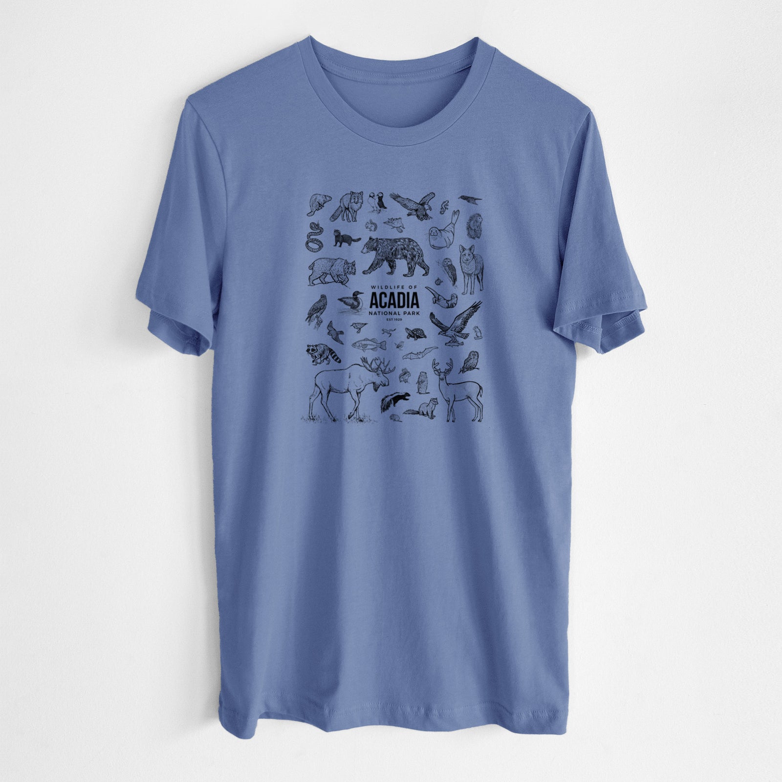 Blue bell lightweight cotton t-shirt laid flat, printed with a collection of black ink wildlife illustrations surrounding the words Acadia National Park.