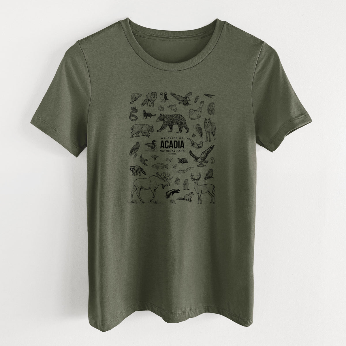 Military green women's relaxed fit cotton t-shirt laid flat, printed with a collection of black ink wildlife illustrations surrounding the words Acadia National Park.
