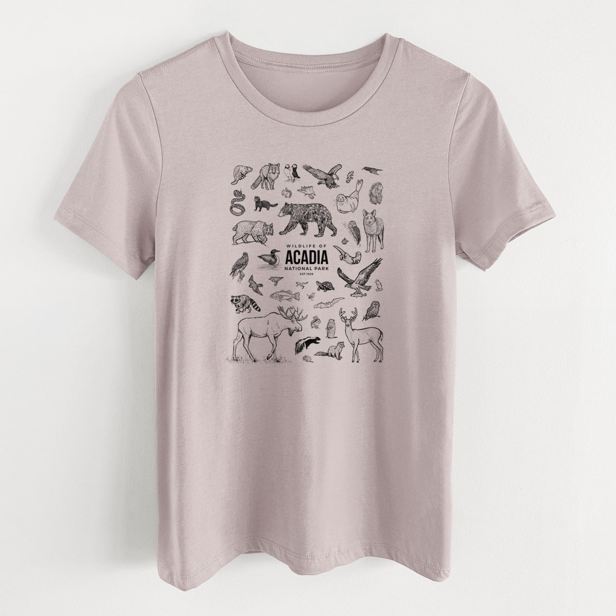 Pink gravel women's relaxed fit cotton t-shirt laid flat, printed with a collection of black ink wildlife illustrations surrounding the words Acadia National Park.
