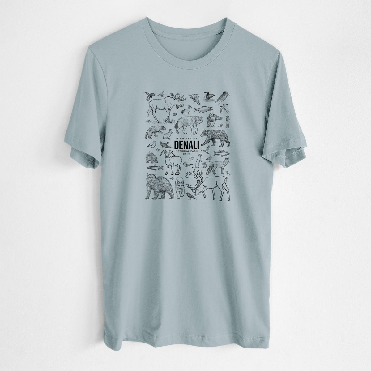 Vintage denim lightweight cotton t-shirt laid flat, printed with a collection of black ink wildlife illustrations surrounding the words Denali National Park.