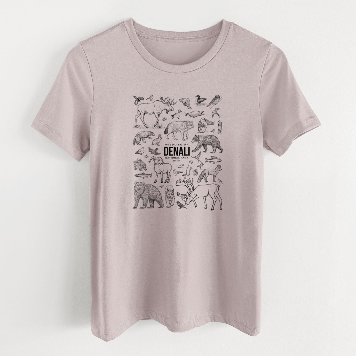 Pink gravel women's relaxed fit cotton t-shirt laid flat, printed with a collection of black ink wildlife illustrations surrounding the words Denali National Park.