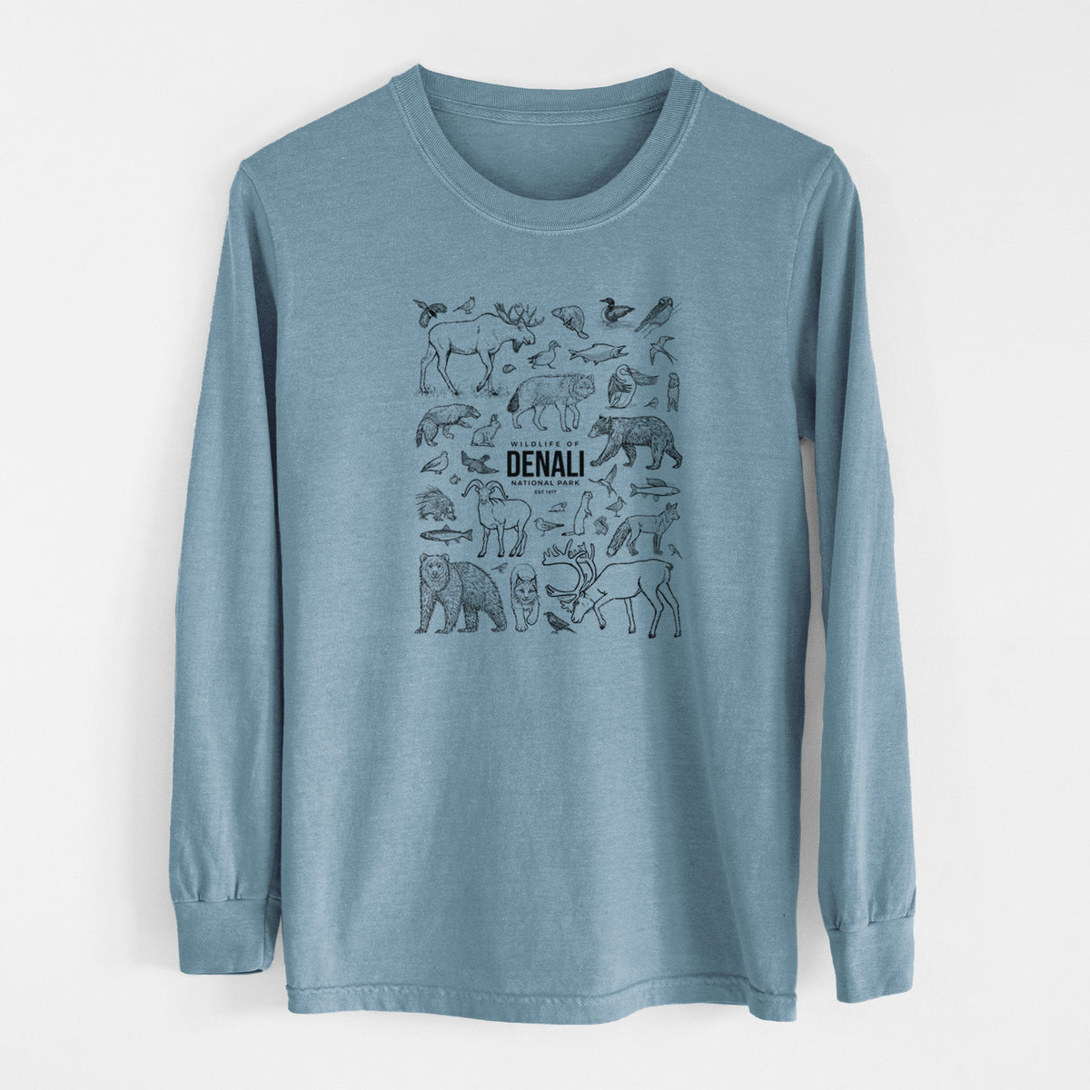 Steel blue Comfort Colors long sleeve shirt laid flat, printed with a collection of black ink wildlife illustrations surrounding the words Denali National Park.