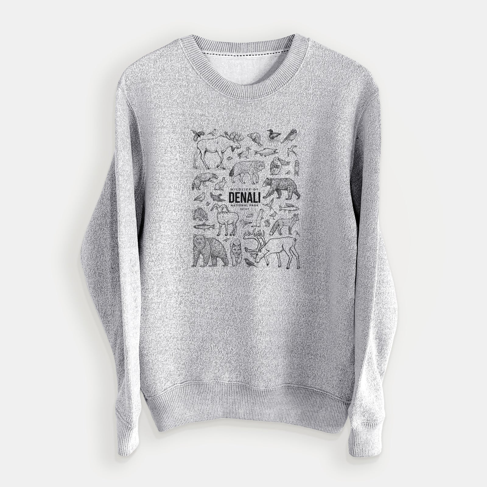 Salt and pepper knit sweatshirt laid flat, printed with a collection of black ink wildlife illustrations surrounding the words Denali National Park.