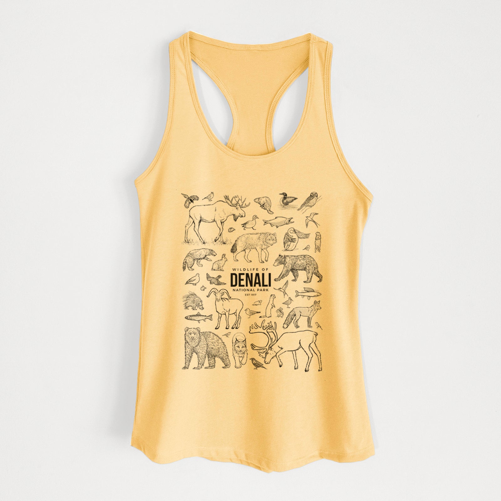 Banana cream women's racerback tank top laid flat, printed with a collection of black ink wildlife illustrations surrounding the words Denali National Park.
