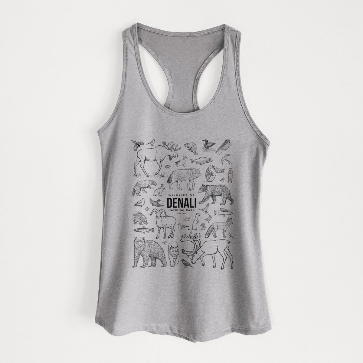 Heather grey women's racerback tank top laid flat, printed with a collection of black ink wildlife illustrations surrounding the words Denali National Park.