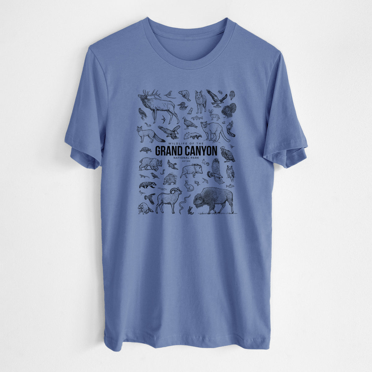 Blue bell lightweight cotton t-shirt laid flat, printed with a collection of black ink wildlife illustrations surrounding the words Grand Canyon National Park.