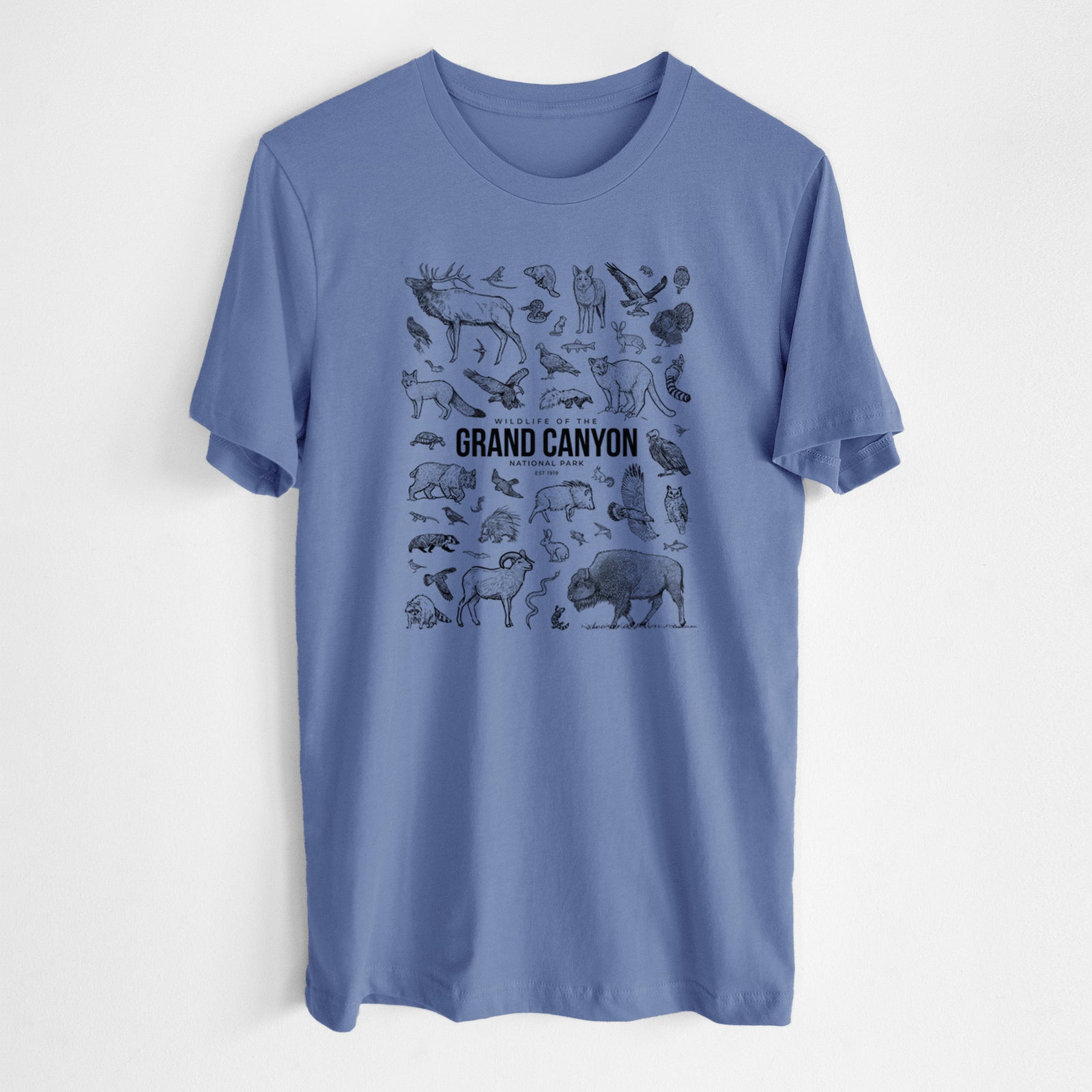 Blue bell lightweight cotton t-shirt laid flat, printed with a collection of black ink wildlife illustrations surrounding the words Grand Canyon National Park.