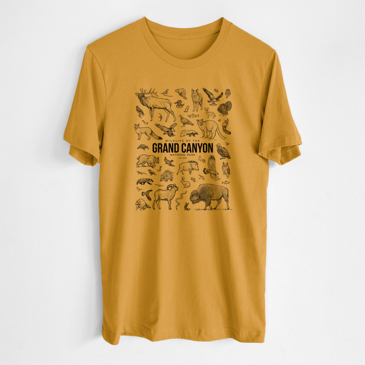 Honeycomb yellow lightweight cotton t-shirt laid flat, printed with a collection of black ink wildlife illustrations surrounding the words Grand Canyon National Park.