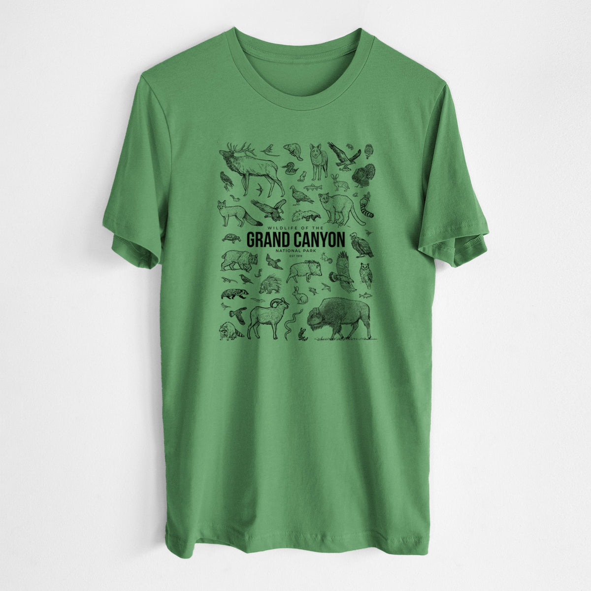 Leaf green lightweight cotton t-shirt laid flat, printed with a collection of black ink wildlife illustrations surrounding the words Grand Canyon National Park.