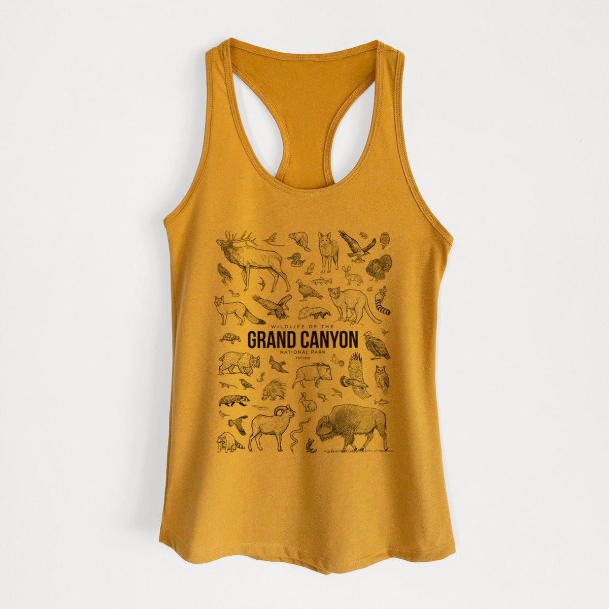 Gold women's racerback tank top laid flat, printed with a collection of black ink wildlife illustrations surrounding the words Grand Canyon National Park.