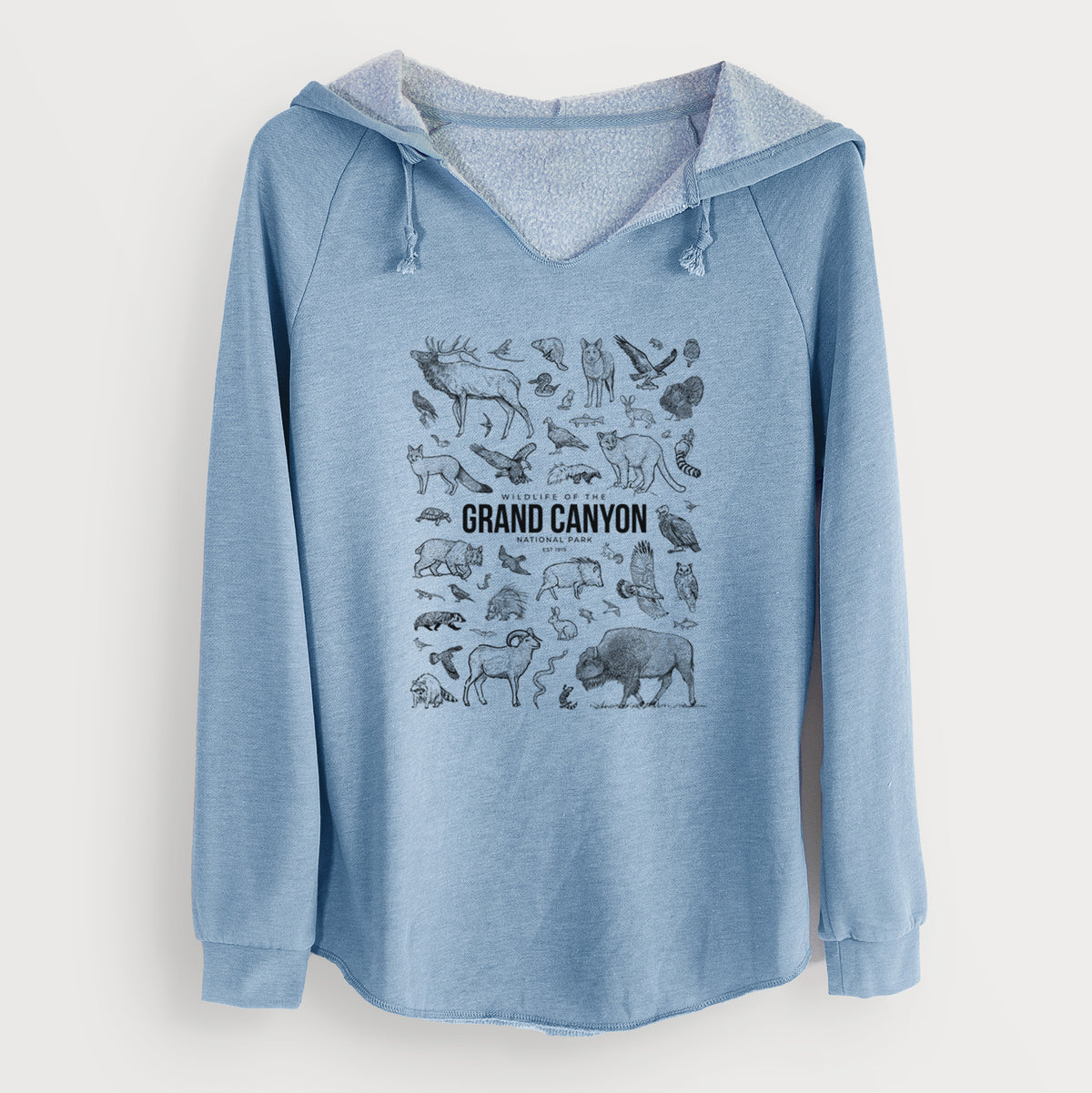 Misty blue women's Cali Wave hooded sweatshirt laid flat, printed with a collection of black ink wildlife illustrations surrounding the words Grand Canyon National Park.
